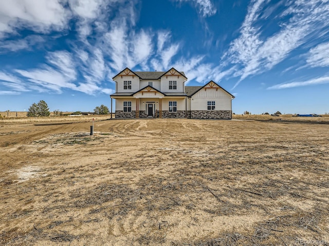 view of front of home featuring a rural view