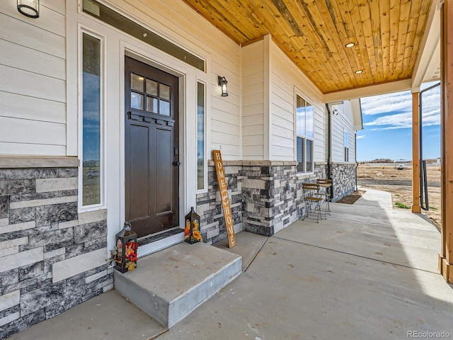 property entrance featuring covered porch