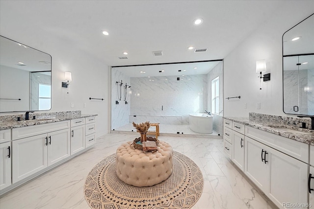 bathroom featuring vanity, a healthy amount of sunlight, and shower with separate bathtub