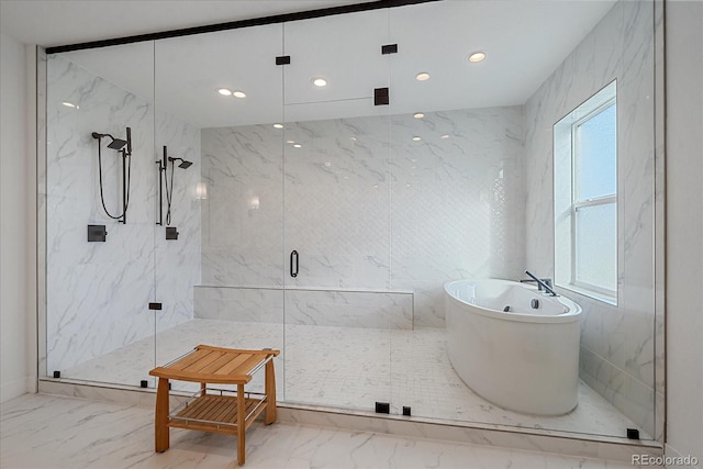 bathroom with shower with separate bathtub