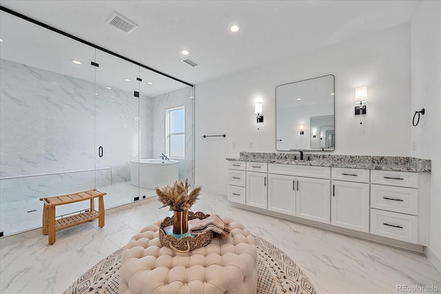 bathroom featuring vanity and plus walk in shower