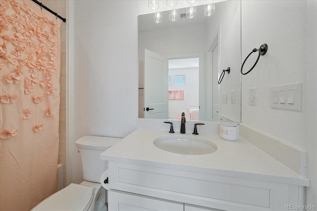 bathroom with vanity and toilet