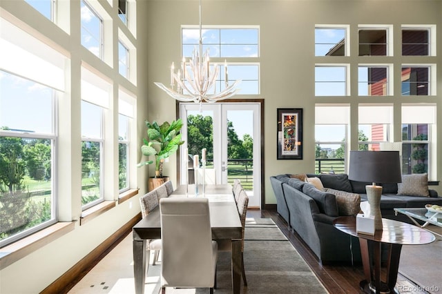 10243 Spring Green Dr, Englewood, CO 80112 - dining space with a chandelier and a towering ceiling