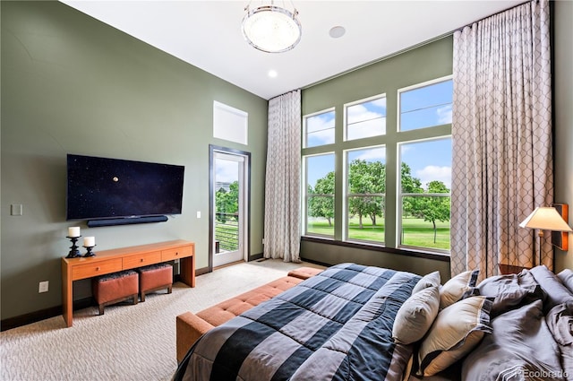10243 Spring Green Dr, Englewood, CO 80112 - bedroom featuring access to outside, carpet flooring, and multiple windows