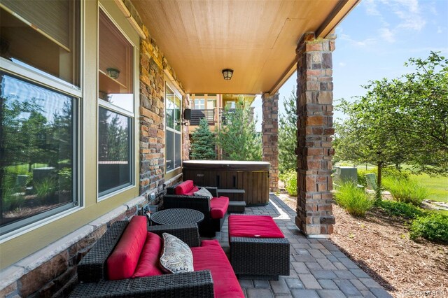 10243 Spring Green Dr, Englewood, CO 80112 - view of patio / terrace featuring a hot tub