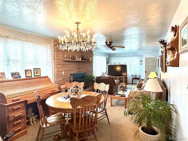647 D St, Salida, CO 81201 - dining room featuring carpet flooring, a fireplace, a ceiling fan, and a chandelier