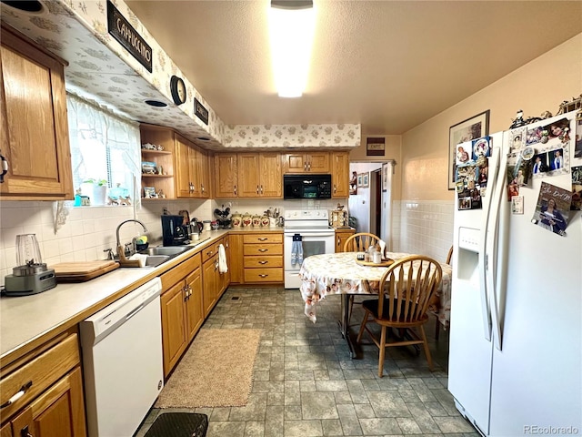 647 D St, Salida, CO 81201 - kitchen featuring white appliances, brown cabinetry, light countertops, and open shelves