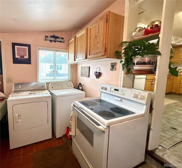 647 D St, Salida, CO 81201 - washroom with washer and dryer and dark tile patterned floors