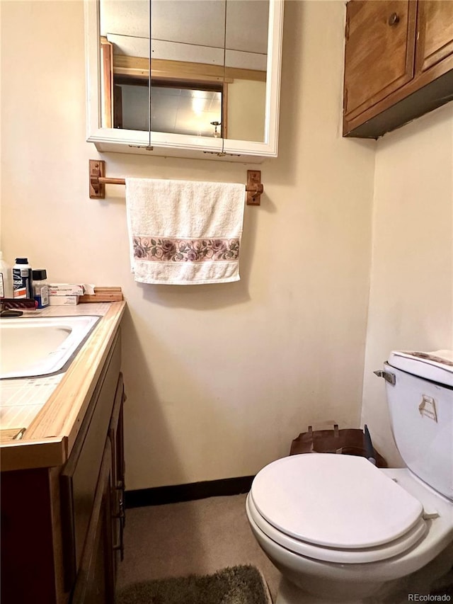 647 D St, Salida, CO 81201 - half bath featuring vanity and toilet
