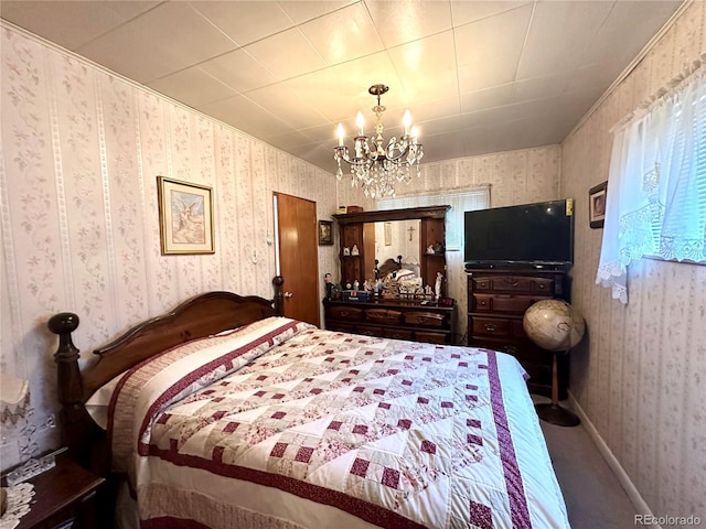 647 D St, Salida, CO 81201 - carpeted bedroom with wallpapered walls and a chandelier