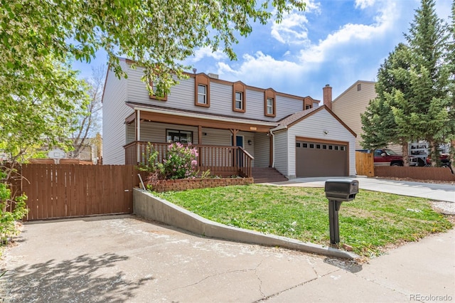 4808 S Ward Way, Morrison, CO 80465 - view of front of house featuring a garage, driveway, and a porch