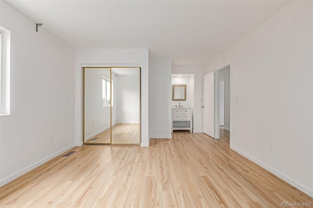 4808 S Ward Way, Morrison, CO 80465 - unfurnished bedroom with light wood-style floors and a closet
