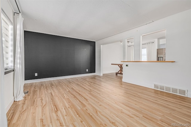 4808 S Ward Way, Morrison, CO 80465 - unfurnished living room featuring light wood-style flooring and baseboards