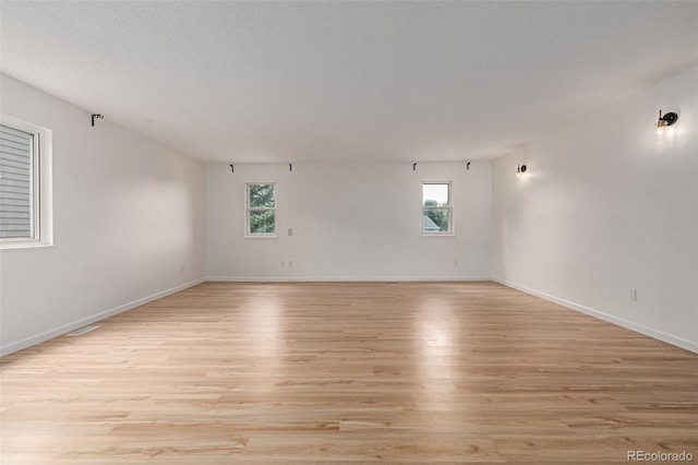 4808 S Ward Way, Morrison, CO 80465 - spare room with light wood-style flooring and plenty of natural light