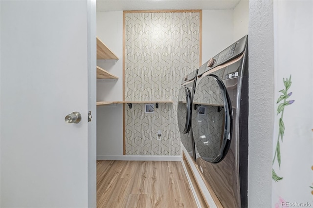 4808 S Ward Way, Morrison, CO 80465 - laundry area with light wood-type flooring and baseboards