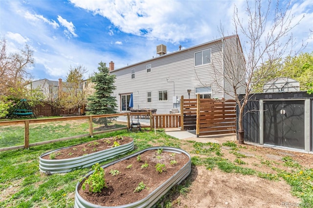 4808 S Ward Way, Morrison, CO 80465 - back of house with a garden