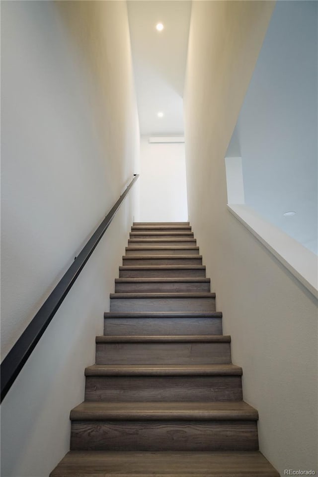 stairway featuring recessed lighting