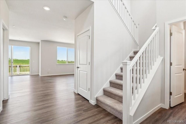 1281 Loraine Cir N, Lafayette, CO 80026 - stairs with wood finished floors, baseboards, and recessed lighting