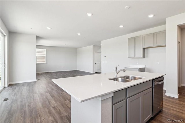 1281 Loraine Cir N, Lafayette, CO 80026 - kitchen with gray cabinets, a sink, stainless steel dishwasher, plenty of natural light, and recessed lighting