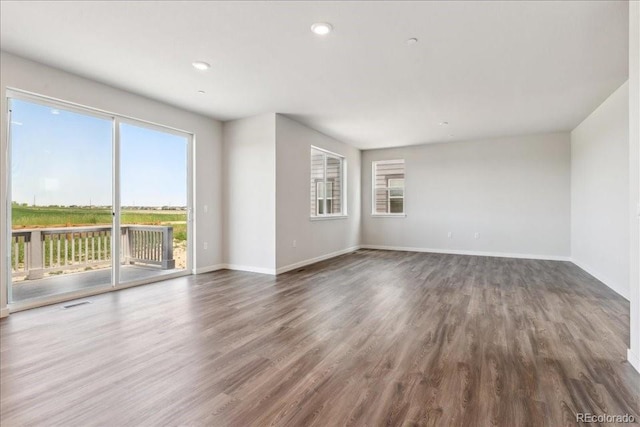 1281 Loraine Cir N, Lafayette, CO 80026 - empty room with wood finished floors, baseboards, and recessed lighting