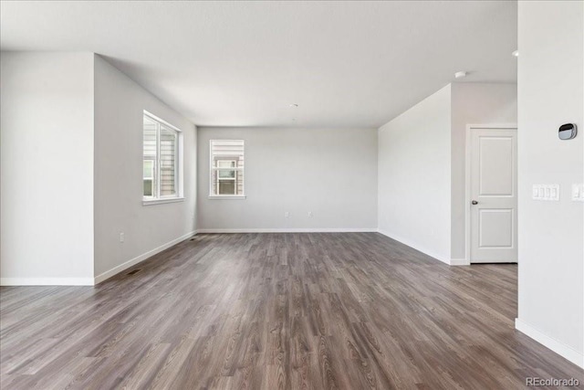 1281 Loraine Cir N, Lafayette, CO 80026 - empty room with dark wood-style flooring and baseboards