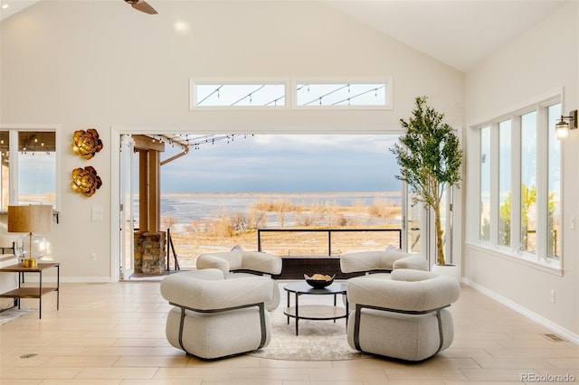 living area featuring high vaulted ceiling