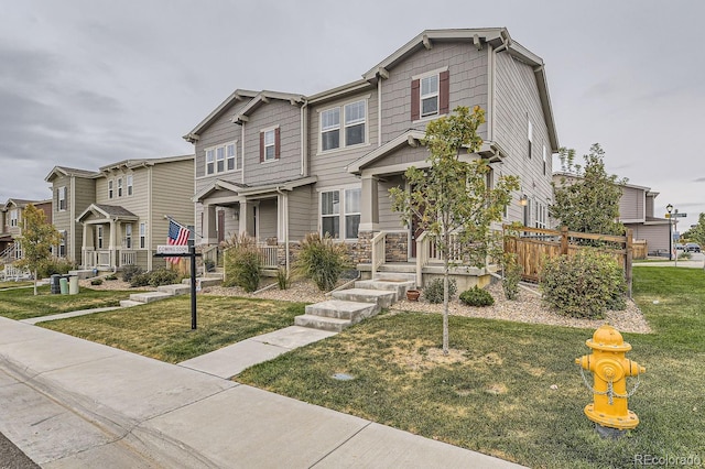 craftsman-style home featuring a front lawn