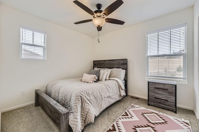 bedroom featuring ceiling fan and carpet