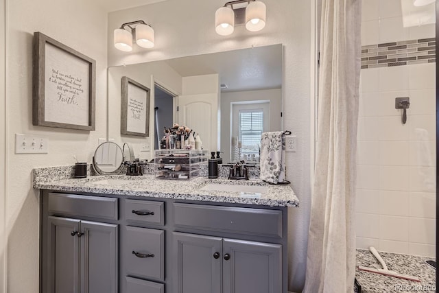 bathroom with vanity and a shower with curtain