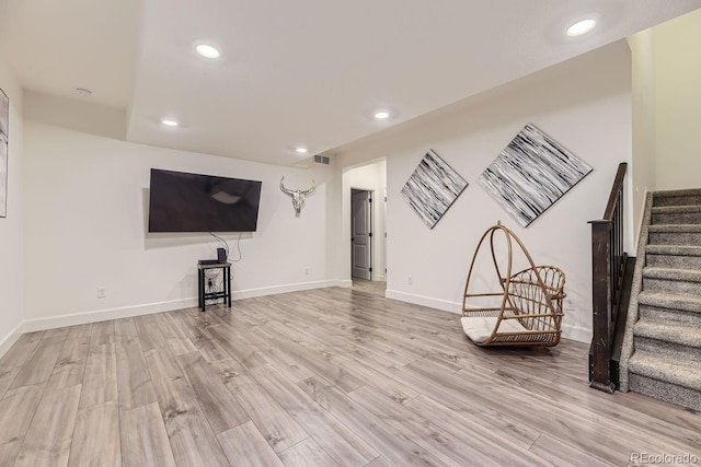 unfurnished living room with light wood-type flooring