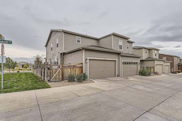 view of front of house with a front yard and a garage