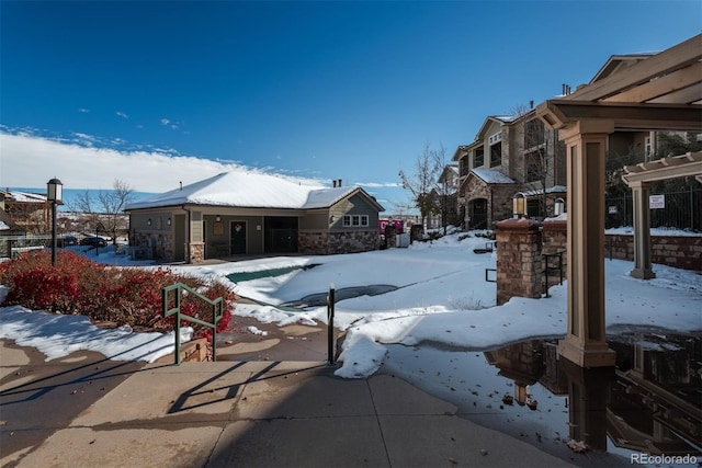 view of snow covered pool