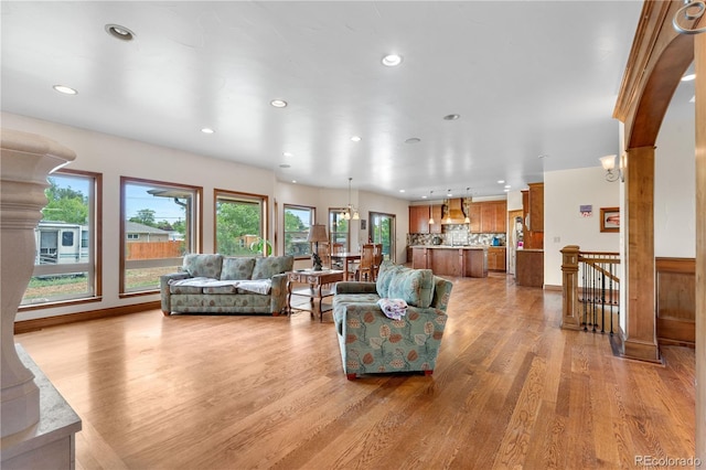 1195 W 70th Ave, Denver, CO 80221 - living area featuring light wood-style flooring and recessed lighting