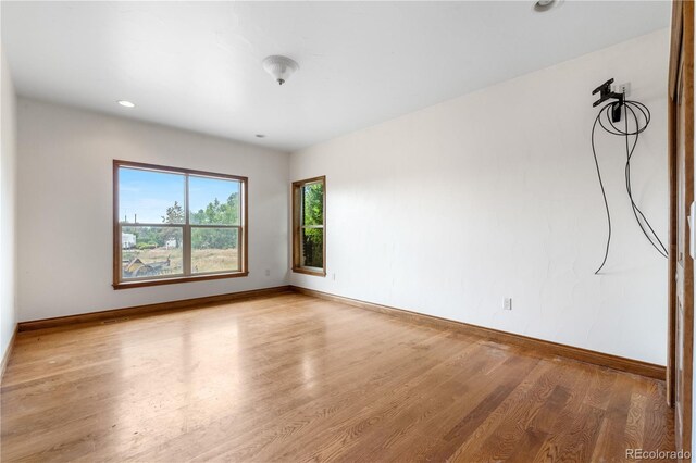 1195 W 70th Ave, Denver, CO 80221 - unfurnished room with wood finished floors and recessed lighting