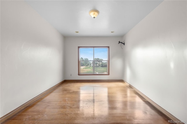 1195 W 70th Ave, Denver, CO 80221 - empty room with wood finished floors and baseboards