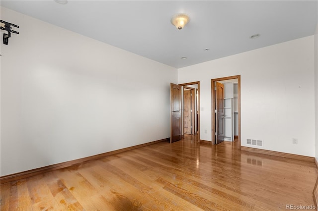 1195 W 70th Ave, Denver, CO 80221 - unfurnished room with light wood finished floors and baseboards
