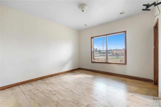 1195 W 70th Ave, Denver, CO 80221 - unfurnished room with light wood-style flooring and baseboards