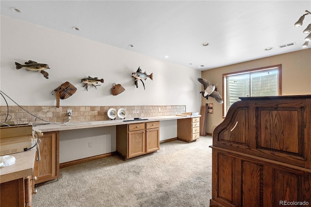 1195 W 70th Ave, Denver, CO 80221 - kitchen featuring light carpet, decorative backsplash, light countertops, and brown cabinets