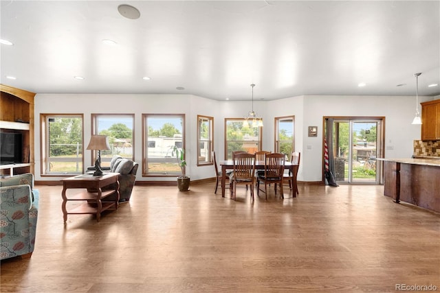 1195 W 70th Ave, Denver, CO 80221 - dining room featuring wood finished floors, plenty of natural light, and recessed lighting