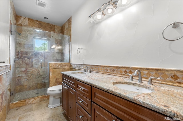 1195 W 70th Ave, Denver, CO 80221 - full bath featuring a shower stall, double vanity, and tile walls
