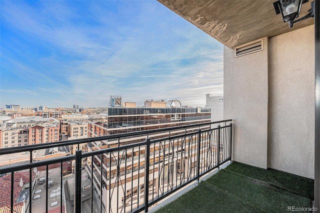 balcony featuring a view of city and visible vents