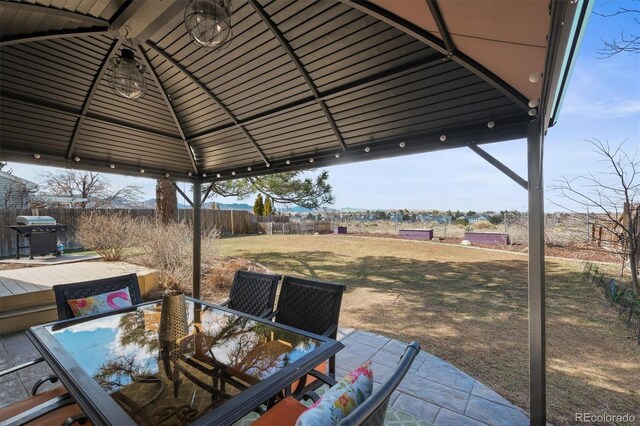8815 W Quarto Cir, Littleton, CO 80128 - view of patio / terrace with outdoor dining area, area for grilling, a gazebo, and a wooden deck