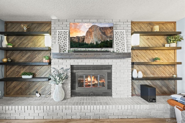 8815 W Quarto Cir, Littleton, CO 80128 - detailed view of wood walls, a fireplace, a textured ceiling, and wood finished floors
