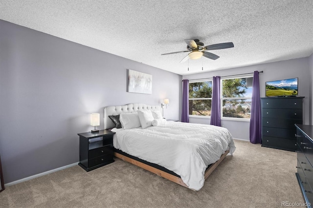 8815 W Quarto Cir, Littleton, CO 80128 - bedroom featuring light carpet, a textured ceiling, a ceiling fan, and baseboards