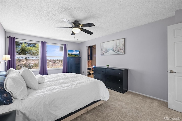8815 W Quarto Cir, Littleton, CO 80128 - bedroom with carpet, a textured ceiling, a ceiling fan, and baseboards