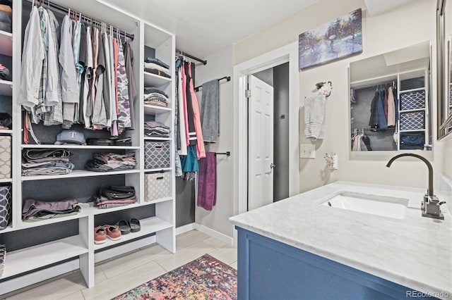 8815 W Quarto Cir, Littleton, CO 80128 - walk in closet with a sink and light tile patterned floors