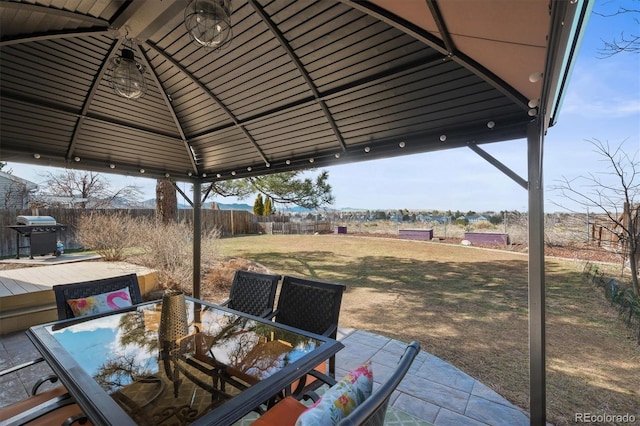 8815 W Quarto Cir, Littleton, CO 80128 - view of patio featuring outdoor dining space, area for grilling, a gazebo, and a deck