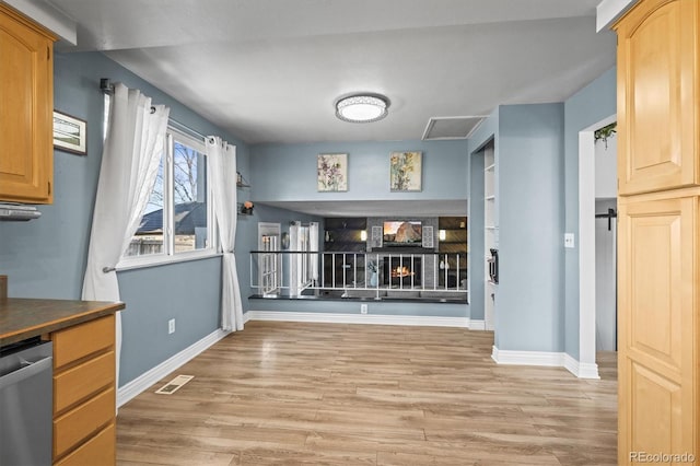 8815 W Quarto Cir, Littleton, CO 80128 - unfurnished dining area featuring light wood-style flooring and baseboards