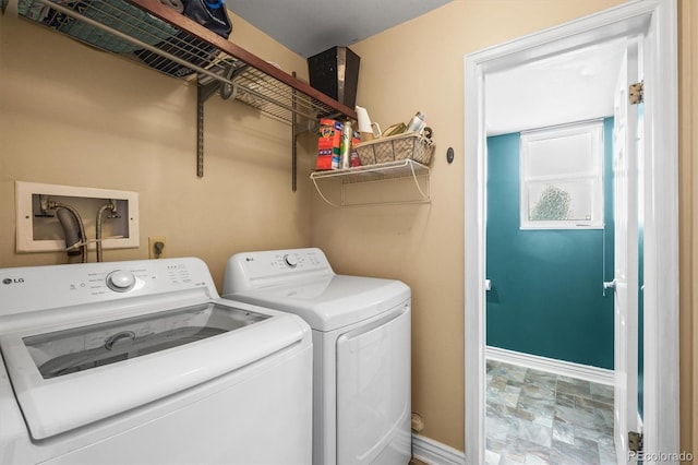 8815 W Quarto Cir, Littleton, CO 80128 - washroom featuring washer and dryer, baseboards, and stone finish flooring