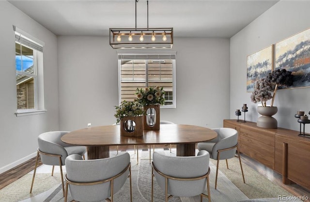 dining space featuring light wood-type flooring